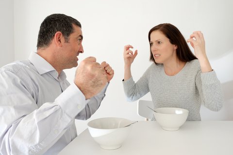 Couple Arguing At Table - The Silly Things Couples Fight About